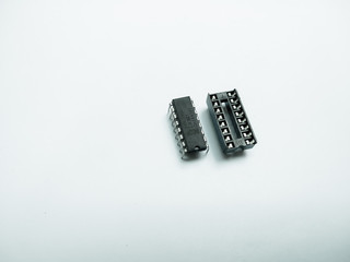 Isolated IC chip and socket on white background