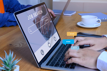 Job search concept, find your career, Person hand using laptop typing into job search.