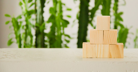 Business plan concept for growth success process. Goal achievement, career ladder. Pyramid of wooden blocks.