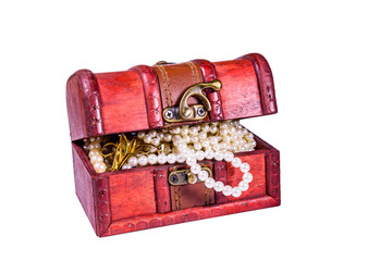 Old box of red wood full of the jewelry isolated on ehite background. Treasure chest