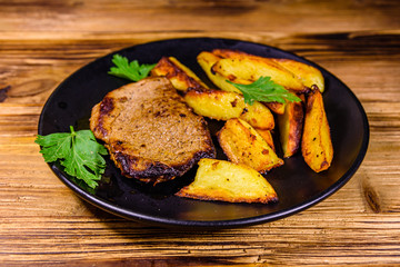 Roasted beefsteak with the fried potato and parsley
