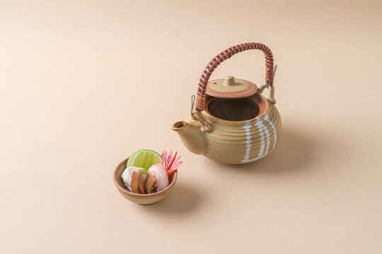 dobin mushi - steamed matsutake mushroom and pike conger with Japanese broth in an earthenware teapot.