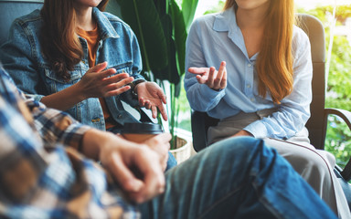 A group of young people sitting and talking together