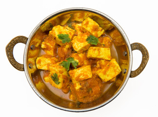 Home made recepie of kadahi paneer or paneer butter masala served in a brass bowl isolated on white available with clipping mask