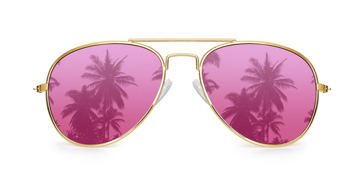 Vacation concept. palm tree reflection in pink aviator sunglasses