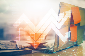 Computer on desktop with point up arrows hologram. Double exposure. Concept of success.