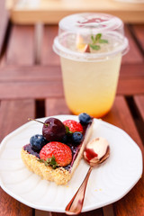 Cheesecake with fresh berries and Passion fruit soda