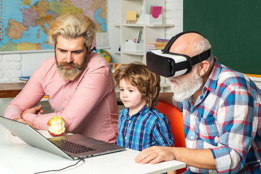 Computer science, Senior teacher wearing virtual reality headset. Father, Grandfather and child son together. Fathers Day.