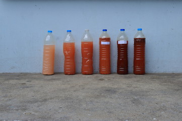 Samples of wastewater collected from various sources in bottles waiting for quality testing