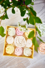 Obraz na płótnie Canvas Gift box with homemade pastel multi color marshmallows.