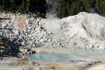 Lassen Volcanic National Park. Rocky trail with grand vistas descends to a boardwalk through Lassen's largest hydrothermal area. Trailhead at Bumpass Hell Parking area.
