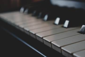 Synthesizer or grand piano keys close up. Monochrome music background concept....