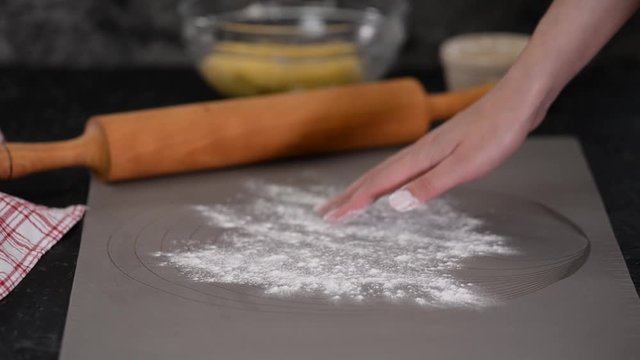 Rolling out shortbread dough for tart.