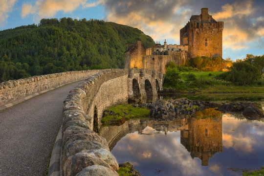 beautiful Sunset and castle reflection at Eilean Donan Castle, Dornie, Highlands, Scotland.