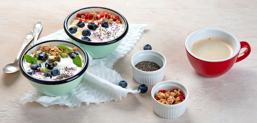 Yogurt breakfast bowls with granola and fruits