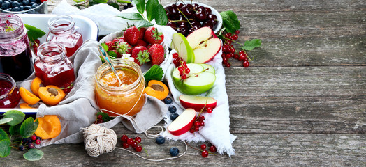 Assortment of jams and seasonal berries, fruits