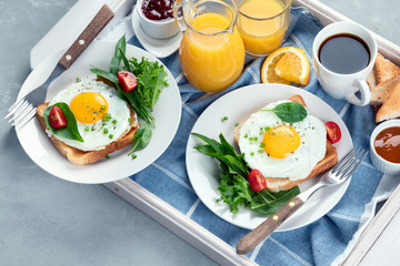 Traditional breakfast on wooden tray