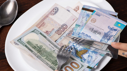 Money tenge, Russian rubles and dollars are on the plate. Sawing the budget, the living wage, or the dual currency basket. The crisis in the countries of the fall in exchange rates.