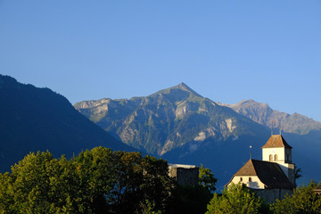 Fototapeta na wymiar Ringgenberg church and mountains early morning, Berner Oberland, Switzerland