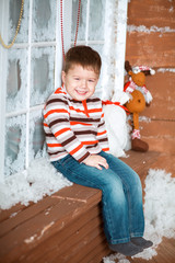 little boy sitting on a bench