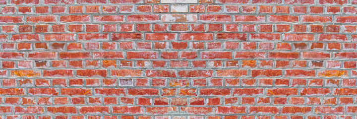 Naklejka premium Panoramic rugged old red brown bricks wall texture. vintage retro industrial banner background.