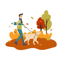 Man wearing sport clothes with umbrella and walking with a dog in the park in the autumn.