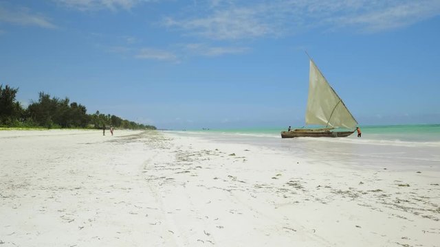 Fishing sailboat on a Paje beach in the ocean at Zanzibar islands.Africa