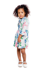 Portrait of pretty little african american girl in white floral dress on white background