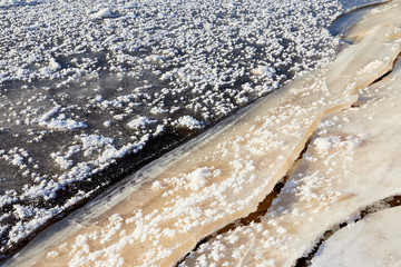 Ice hummock on Frozen River in winter sunny day. Sparkling ice texture or background.