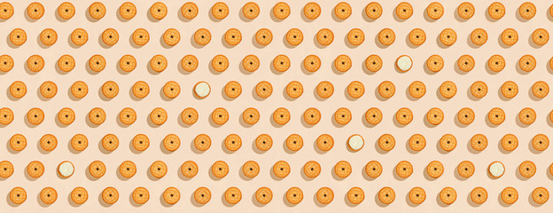 Biscuits stuffed with cream on a bright yellow background, a recurring seamless pattern, sweet background, wallpaper. Copy space, banner. top view