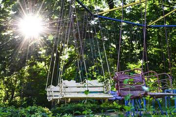 An empty playground in park, which is forbidden to visit during the quarantine period of the...