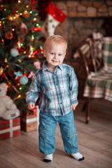 little boy with christmas tree