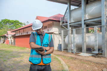 Engineers work place to keep liquid helium,preventive maintenance schedule checking,Thailand people