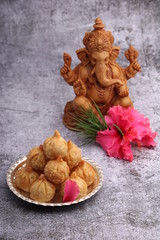 Ganesh Puja - Sweet Modak food offered on Ganpati festival or Chaturthi in India. in silver plate