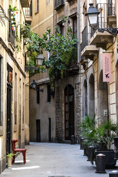 A narrow tiny street in the gothic area in Barcelona, Spain