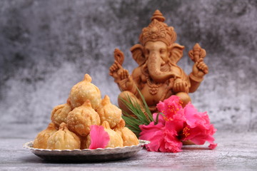 Ganesh Puja - Sweet Modak food offered on Ganpati festival or Chaturthi in India. in silver plate