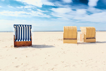 Blue and white striped beach chair or bench