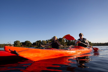 Kayaking. People paddling a kayak. Canoeing. Paddling.