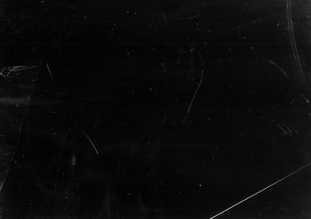 Dust scratches overlay. Old film effect. Black faded stained surface with smeared dirt.
