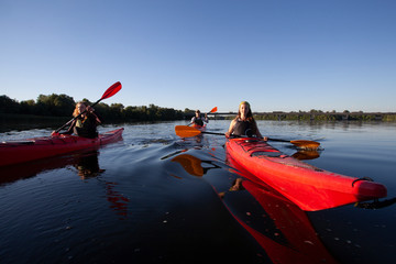 Kayaking. People paddling a kayak. Canoeing. Paddling.