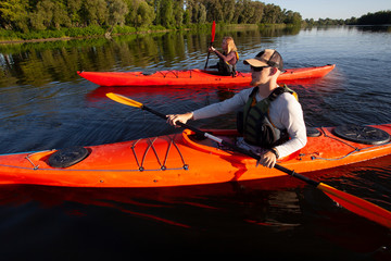 Kayaking. People paddling a kayak. Canoeing. Paddling.