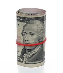 Bundle of rolled up american ten dollar bills, banknotes, cash money roll isolated on white...