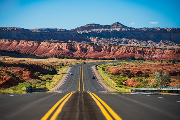 Natural american landscape with asphalt road to horizon.