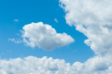 Naklejka na ściany i meble Blue sky with white clouds. Horizontal shot