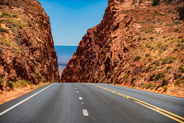 Asphalt highways and mountains. Road against the high rocks.