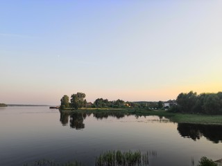 Obraz premium sunset over the river