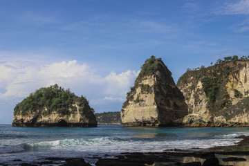 The beautiful Diamond Beach on Nusa Penida Island, Bali, Indonesia. Amazing  view, white sand beach with rocky mountains and azure lagoon with clear water of Indian Ocean 
