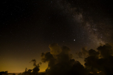 Naklejka premium Milky way in the night sky with cloud- long exposure photo on Monte Rosa