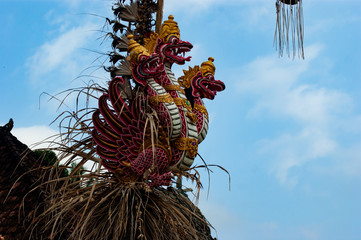 Three-headed dragon, placed on top of a house, in a small village in Bali, Indonesia, near the...