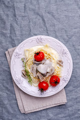 Traditional pasta with mushrooms and tomatoes